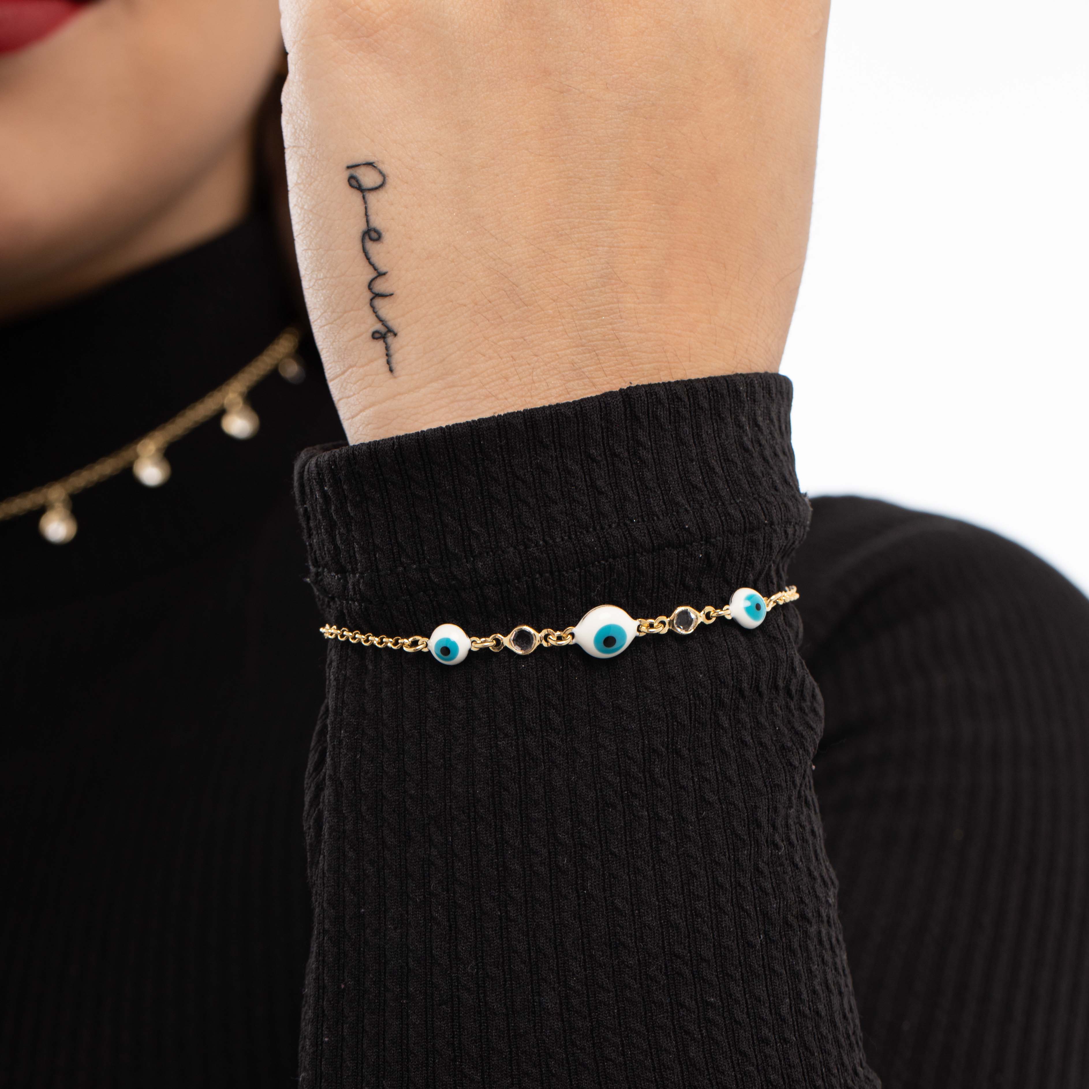 PULSEIRA ELO PORTUGUES FINO COM OLHO GREGO E PEDRA EM ACRILICO CRISTAL COM EXTENSOR - BANHADO A OURO 18K