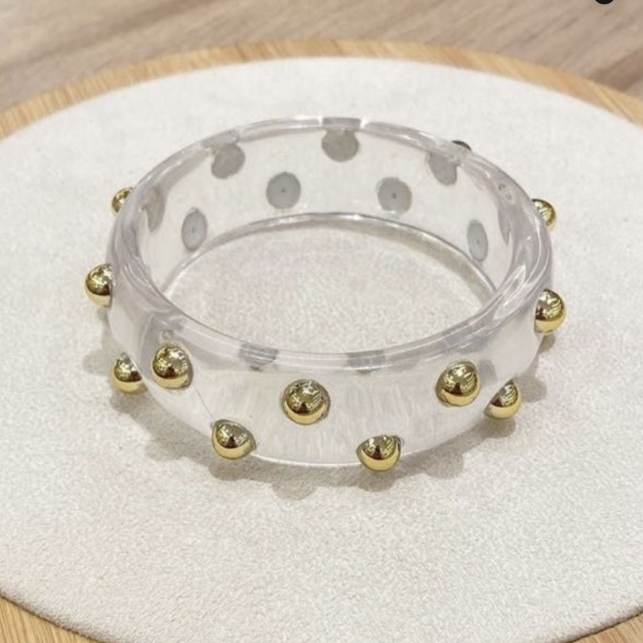 BRACELETE ACRÍLICO COM DETALHES DOURADOS