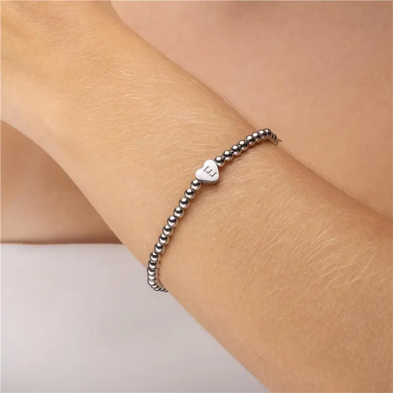 PULSEIRA BOLINHAS LETRA E