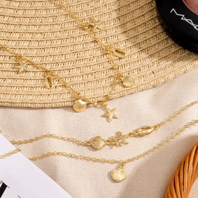 COLAR PINGENTES ESTRELA DO MAR E CONCHAS