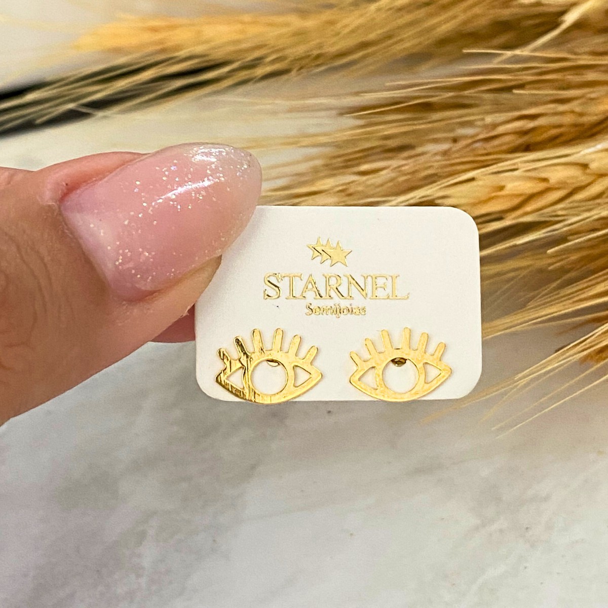 BRINCO PEQUENO LISO OLHO GREGO COM CILIOS