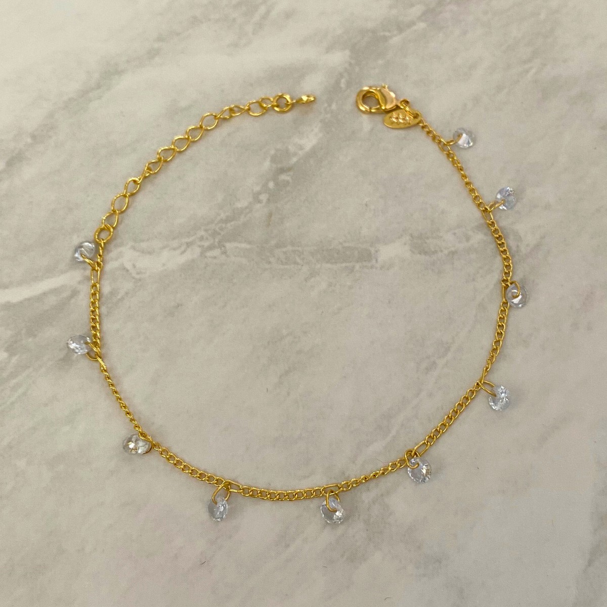 PULSEIRA COM PINDURICALHO DE PONTO DE LUZ REDONDO CRISTAL