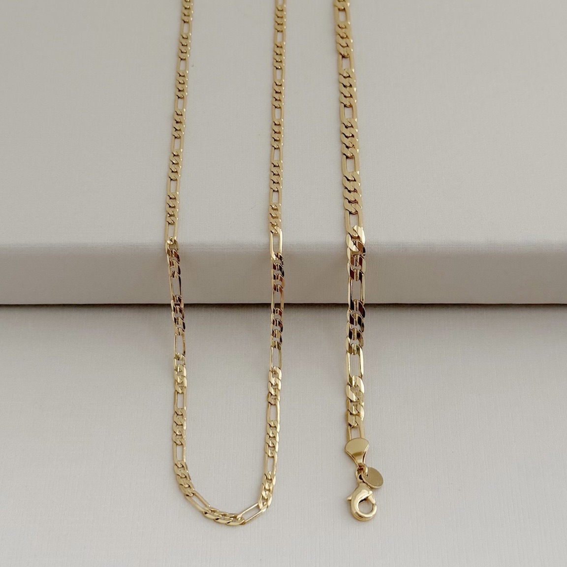 12.1921.0.O - Pulseira de elos figaro tres/um lisos de 0,45cm