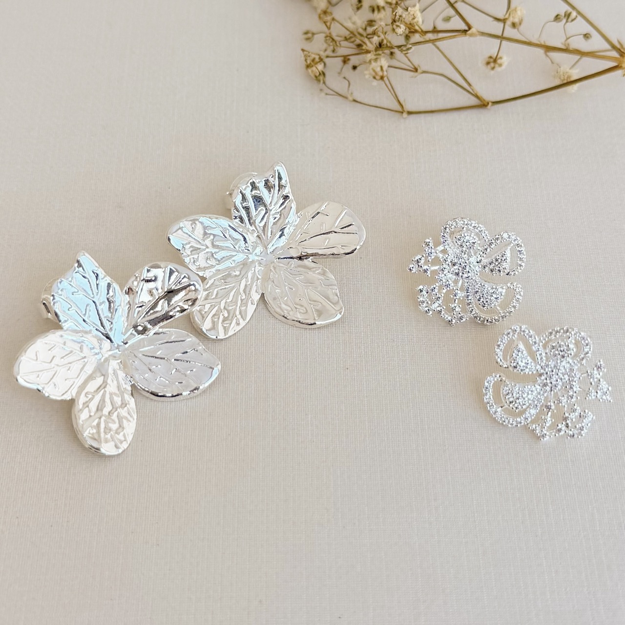 06.1850.0.S - Brinco de chapa em flor estrela desenhada