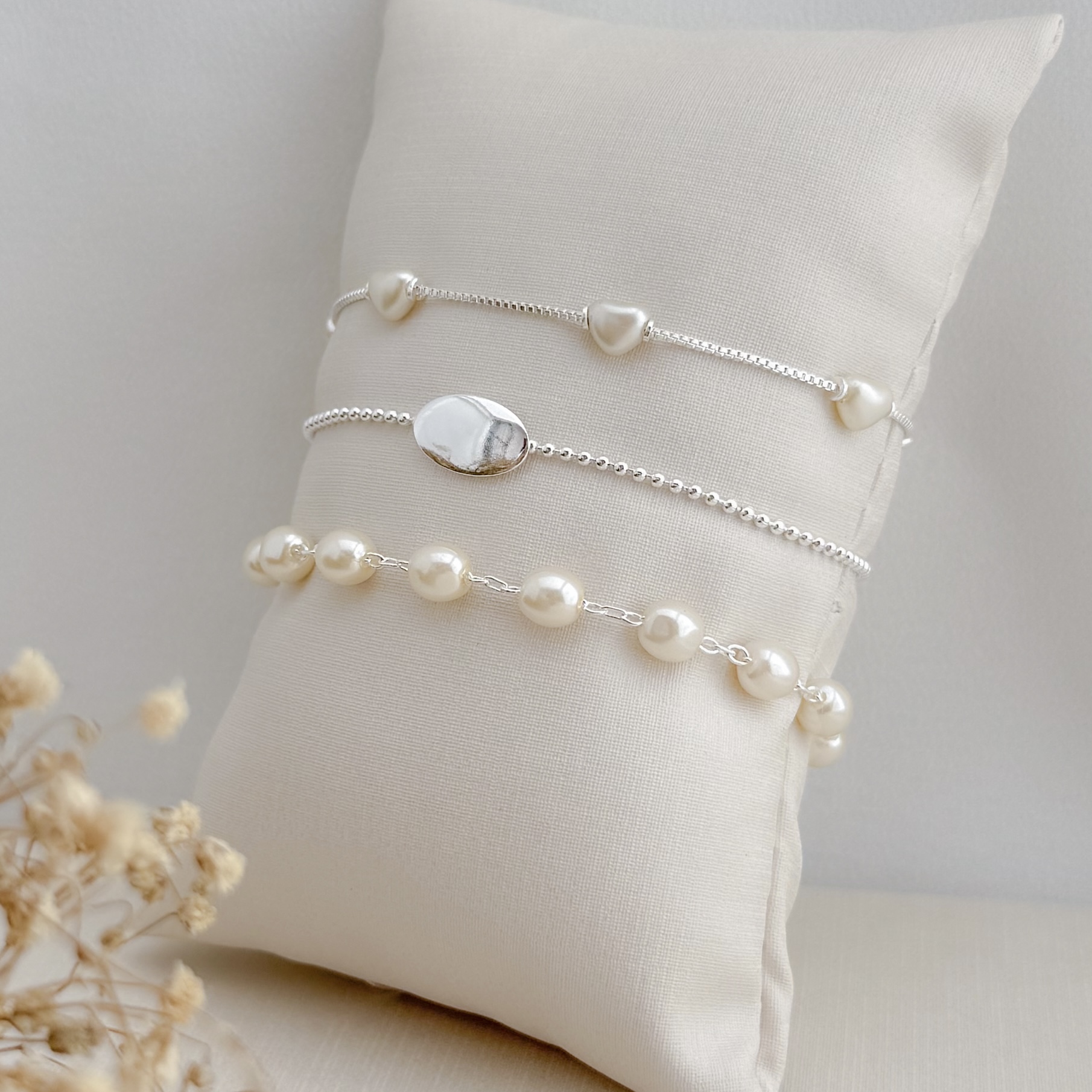 12.2221.15.S - Pulseira de perolados ovais em elos circulares clássicos