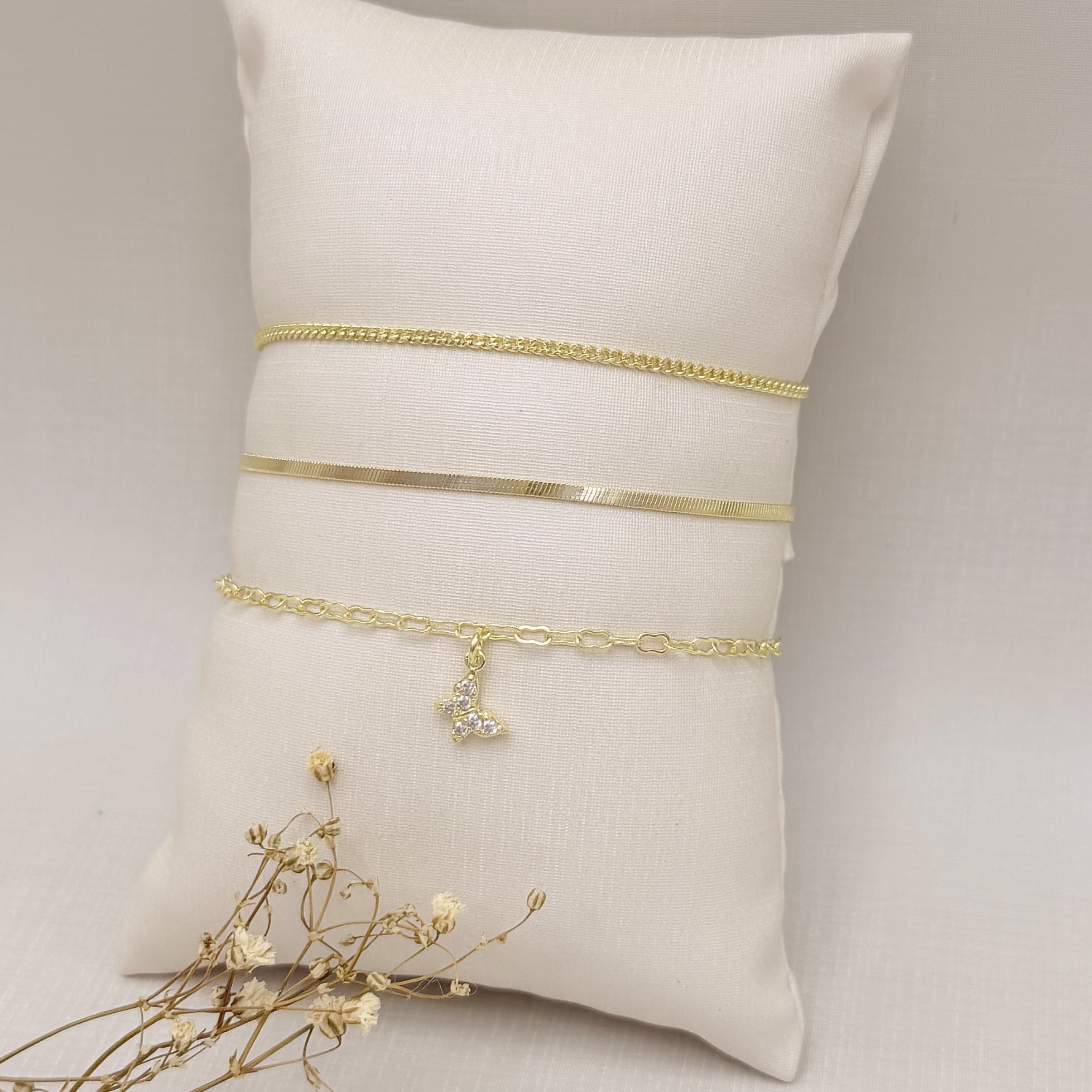 12.2263.1.O - Pulseira elo oito com pingente de borboleta cravejada