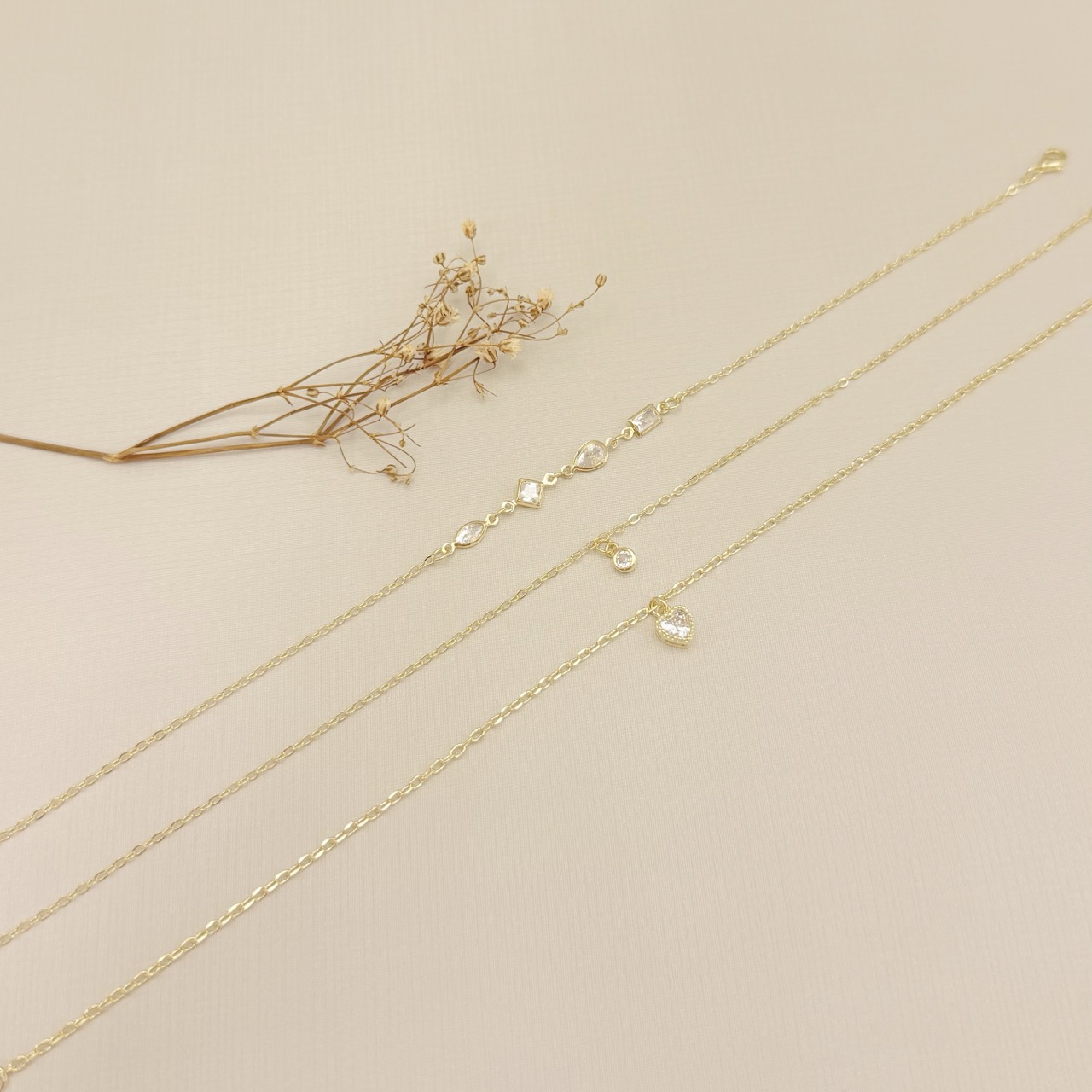 14.0332.1.O - Tornozeleira elo americano 1,6mm com pingente ponto de luz caixa luxo inglesa