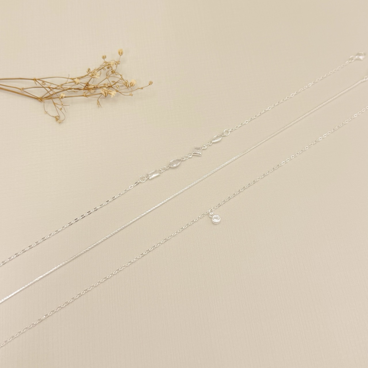 14.0332.1.S - Tornozeleira elo americano 1,6mm com pingente ponto de luz caixa luxo inglesa