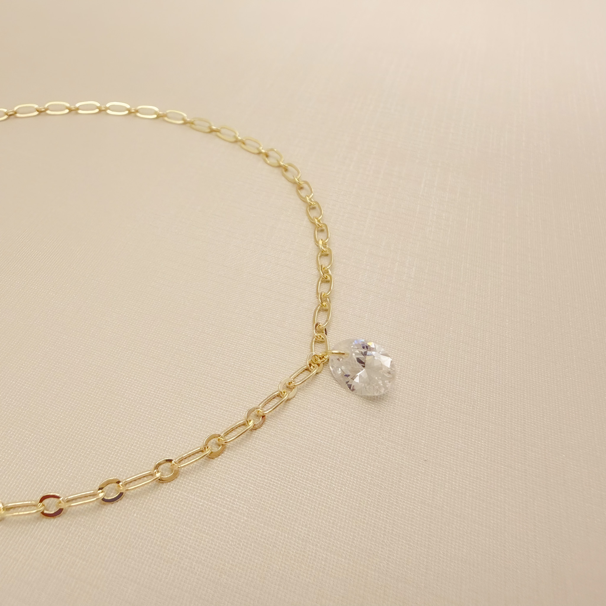 14.0311.1.O -Tornozeleira de elos ovais longos com pingente de ponto de luz oval