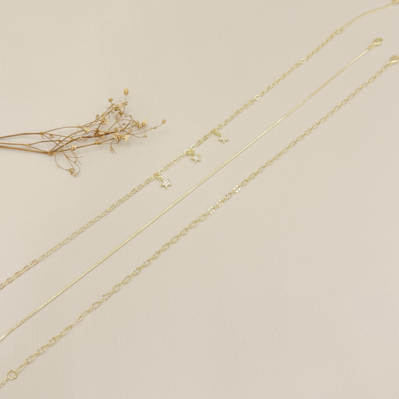 14.0321.0.O - Tornozeleira de elos ovais em efeito orgânico