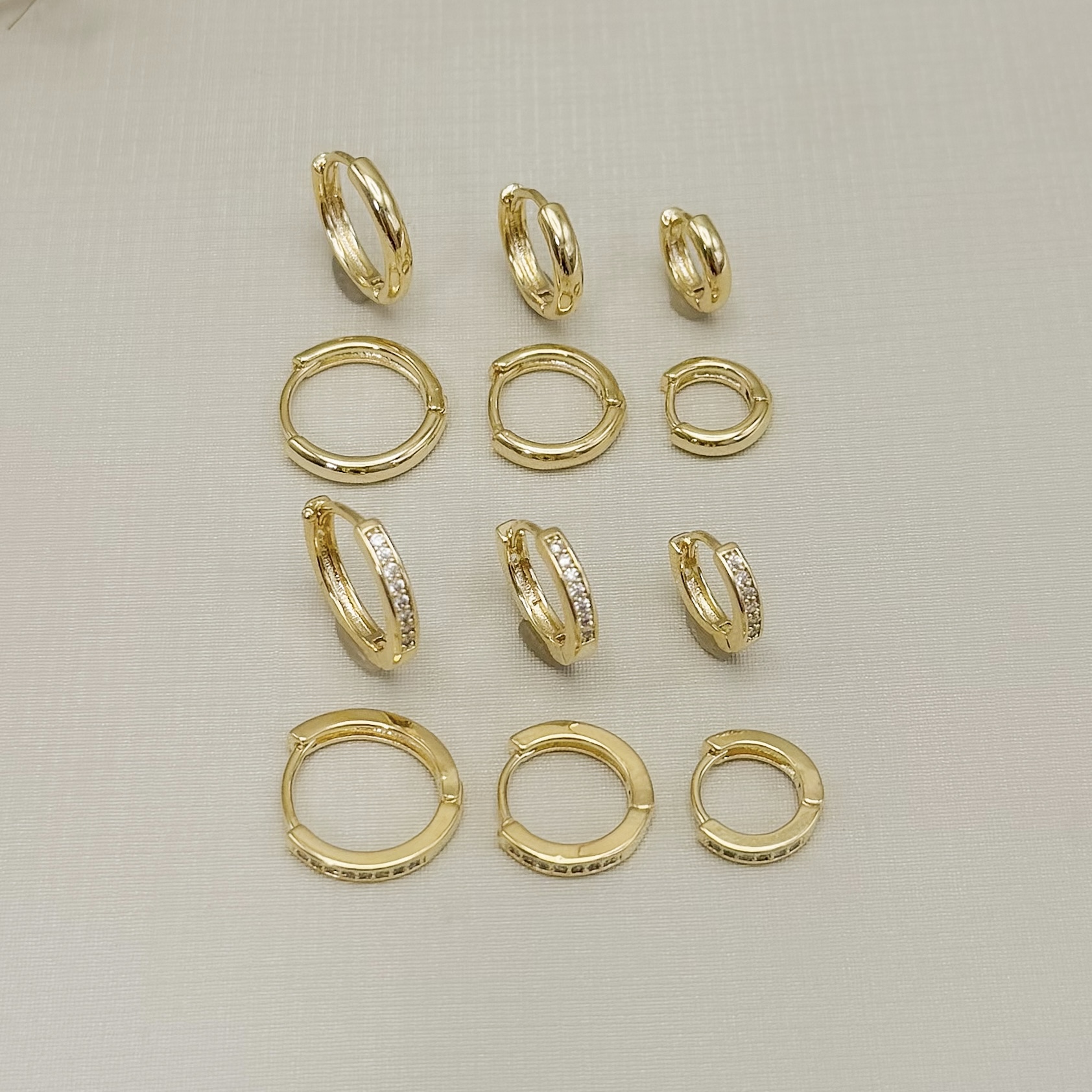 05.3163.0.O - Trio de argolas em tubo abaloado liso em formato clássico liso