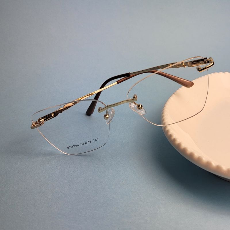 Armacao para oculos de grau gatinho parafusado dourado perna marrom