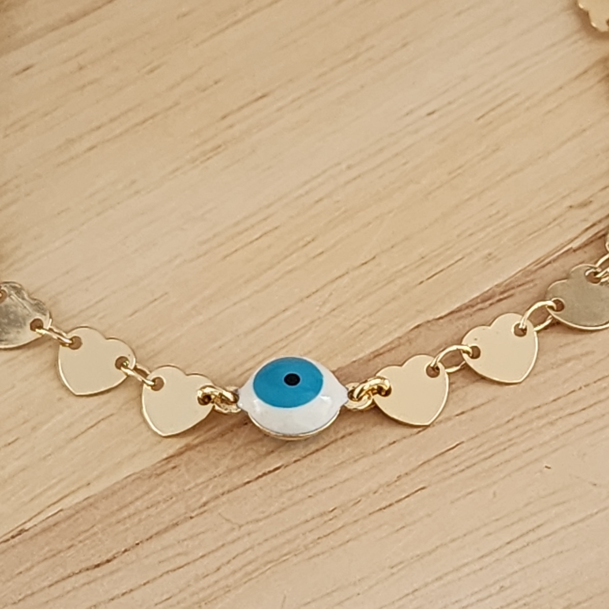PULSEIRA DOURADA CORRENTE CORAÇÕES COM OLHO GREGO