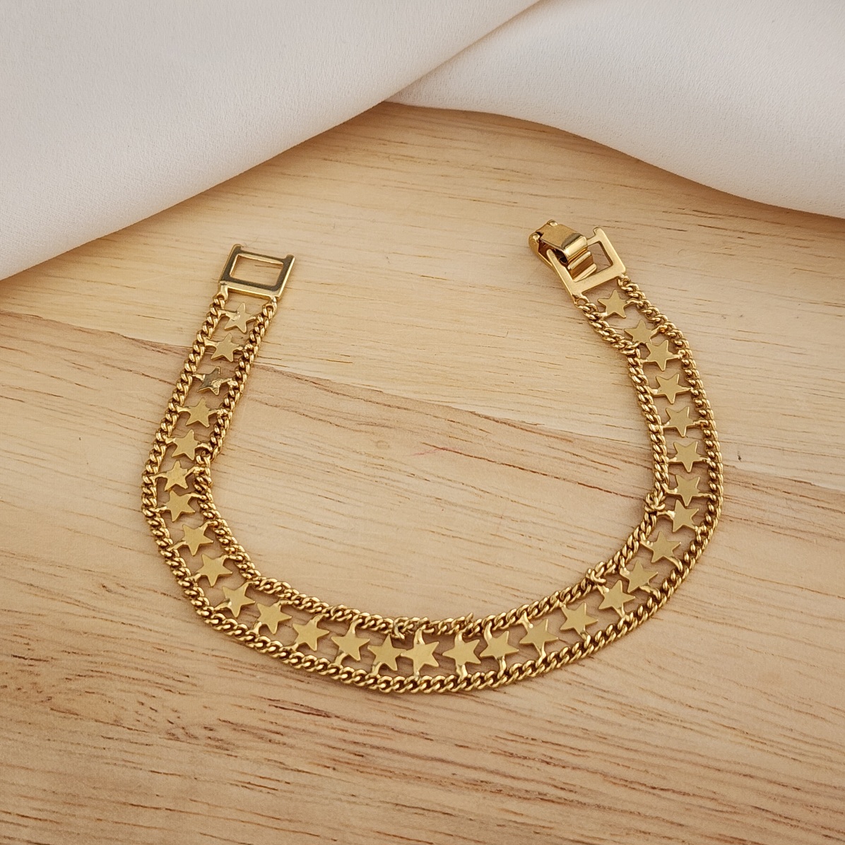 PULSEIRA DOURADA LARGA ESTRELAS