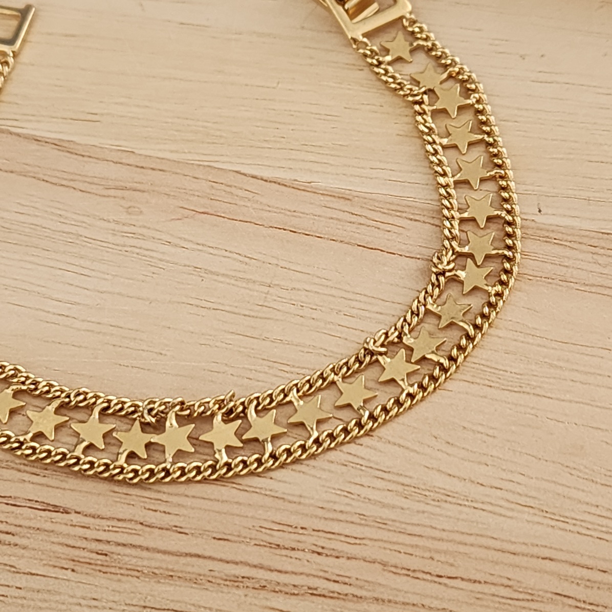 PULSEIRA DOURADA LARGA ESTRELAS