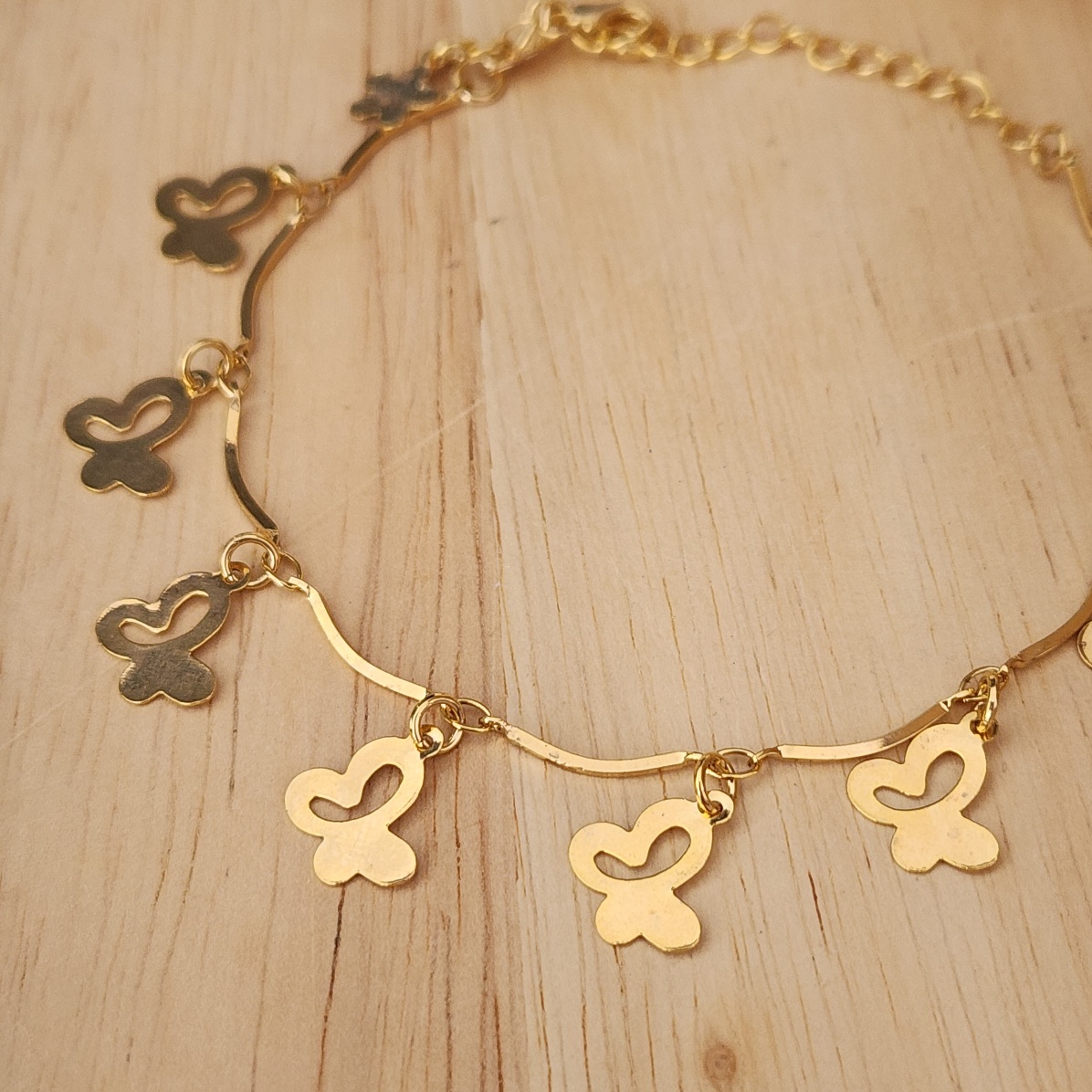 PULSEIRA DOURADA PINGENTES BORBOLETAS