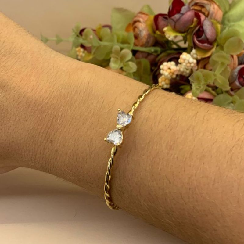 BRACELETE TRANÇADO COM LAÇO EM ZIRCÔNIA DE CORAÇÃO