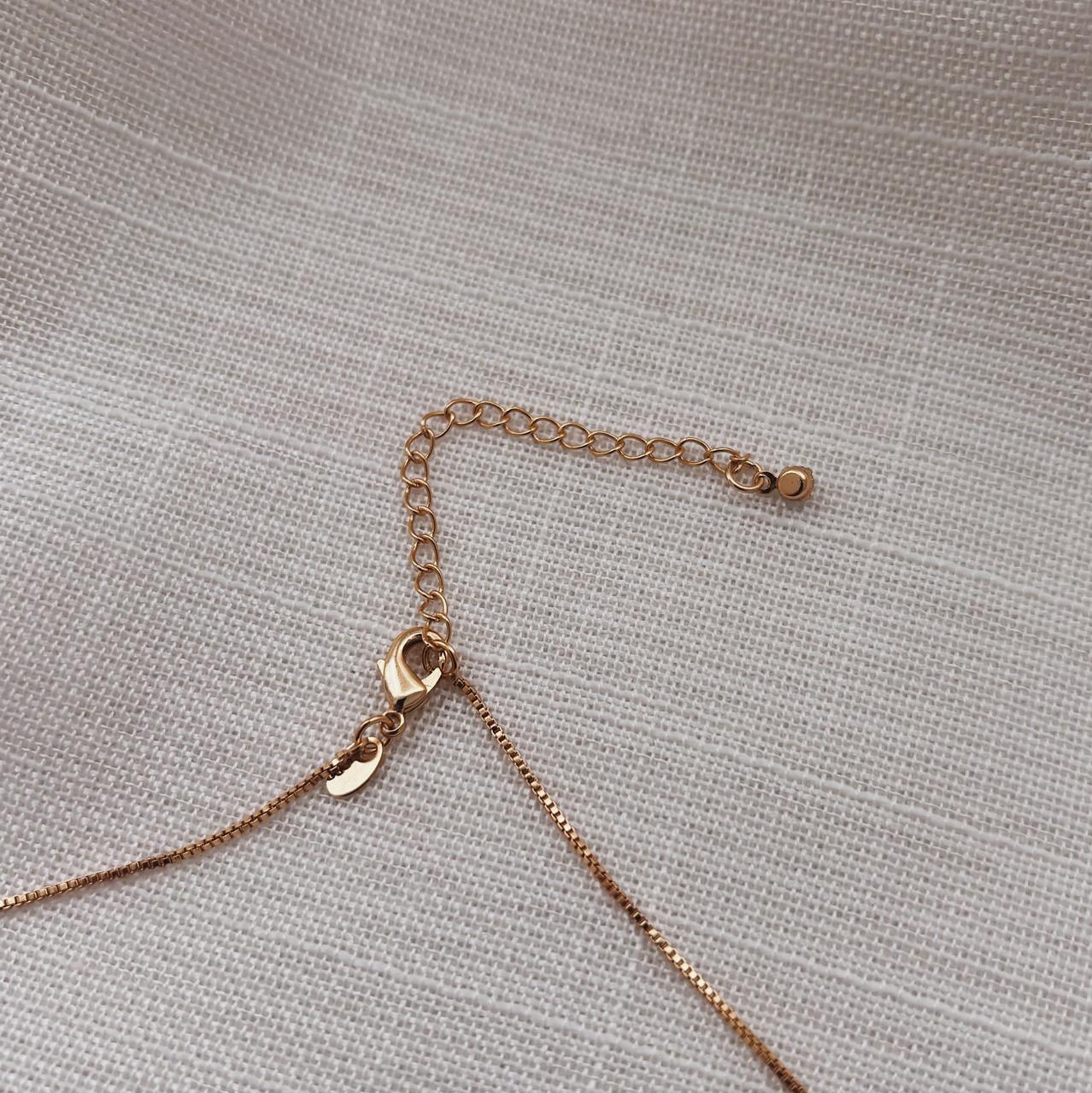 COLAR COM PONTO DE LUZ 5MM MH. 45CM DE COMPRIMENTO E 5CM DE REGULAGEM. BANHADO A OURO 18K.