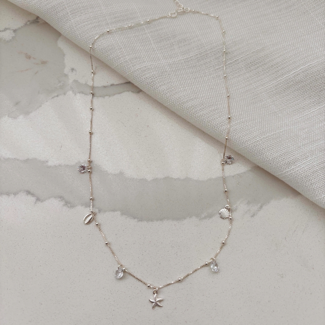 COLAR MAR (BÚZIO, ESTRELA DO MAR E CONCHA). 40CM DE COMPRIMENTO E 10CM DE REGULAGEM. EM PRATA 925.