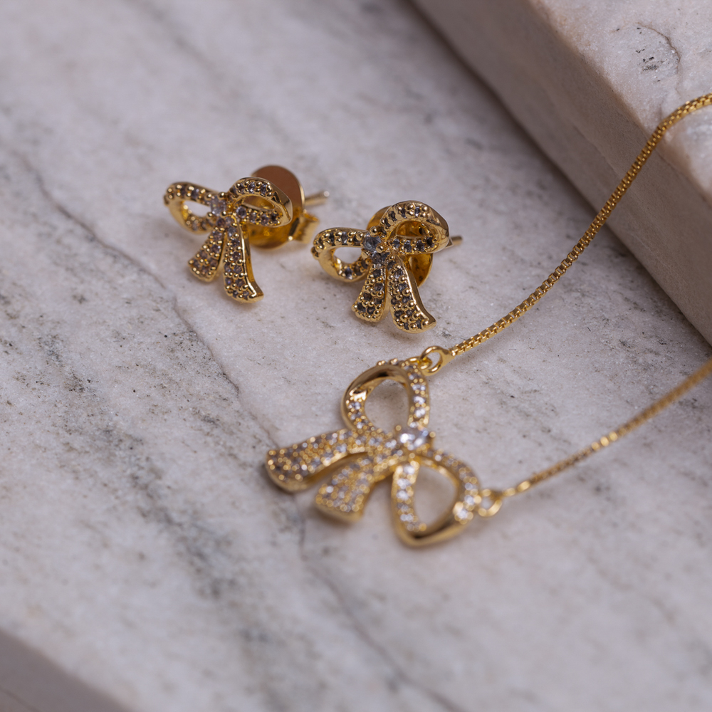 CONJUNTO LAÇO COM ZIRCÔNIAS CRISTAIS BANHO OURO 18K