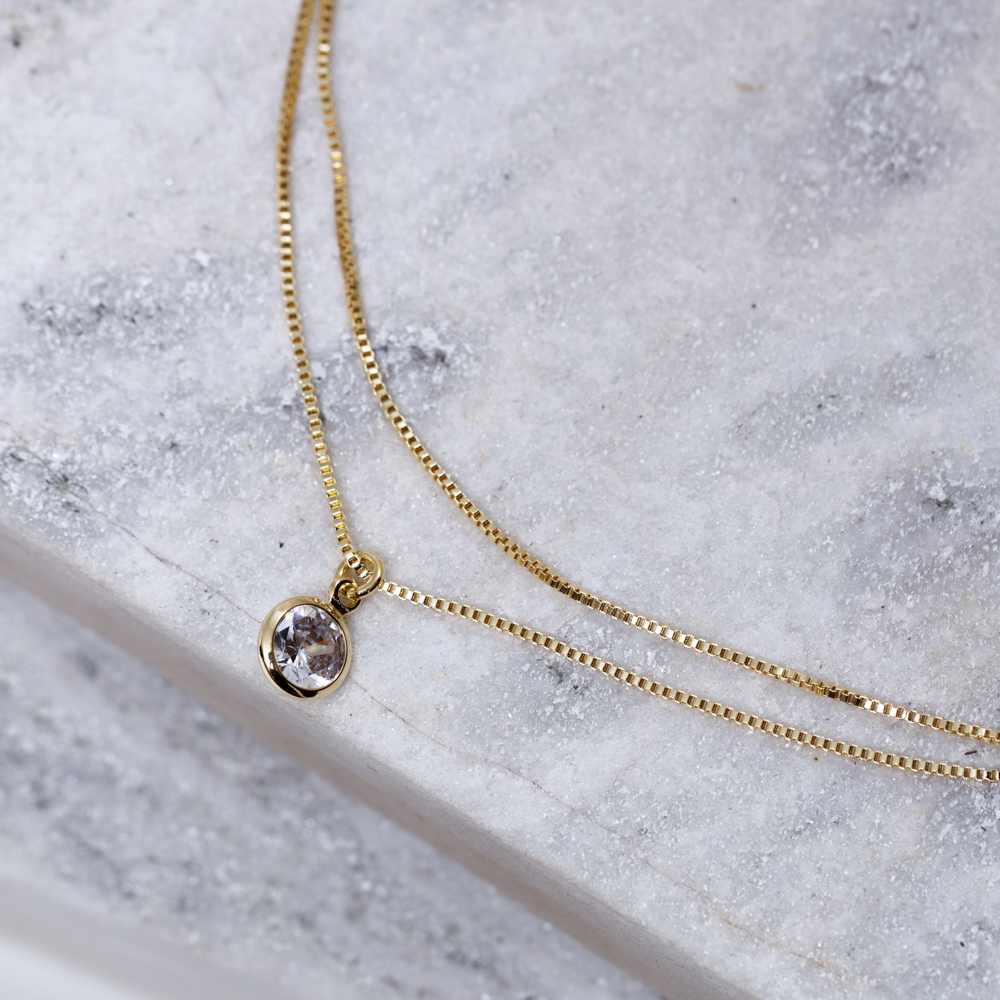 TORNOZELEIRA DUPLA COM CRISTAL BANHO OURO 18K