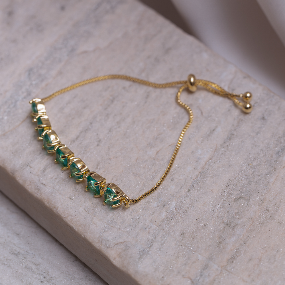 PULSEIRA CORAÇÃO COM PEDRAS VERDES FECHO GRAVATINHA BANHO OURO 18K