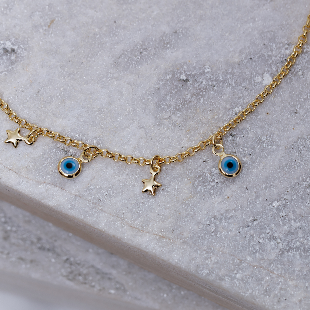 TORNOZELEIRA OLHO GREGO E ESTRELAS BANHO OURO 18K