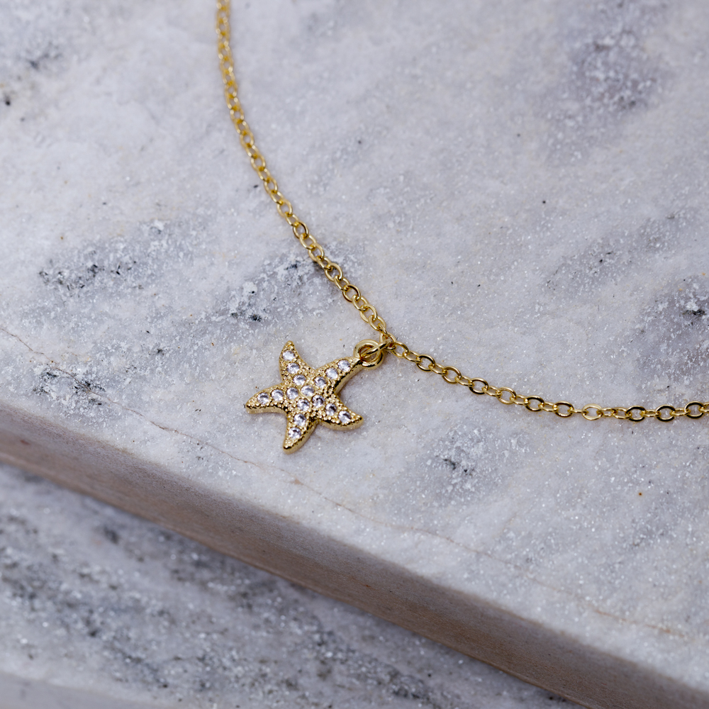 TORNOZELEIRA ESTRELA DO MAR CRAVEJADA BANHO OURO 18K