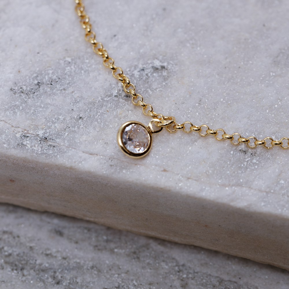 TORNOZELEIRA COM PONTO DE LUZ CRISTAL BANHO OURO 18K