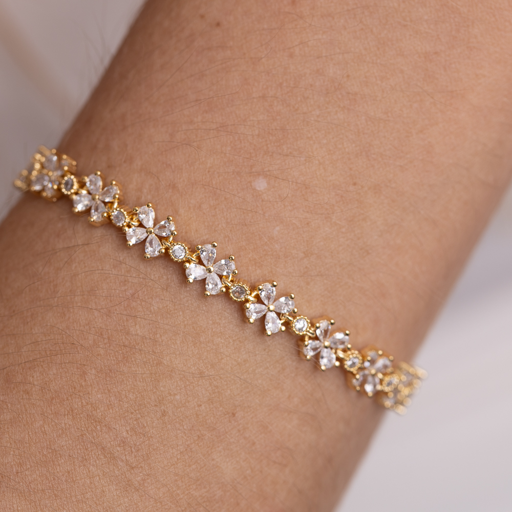 PULSEIRA FLORZINHA RIVIERA CRISTAL BANHO OURO 18K