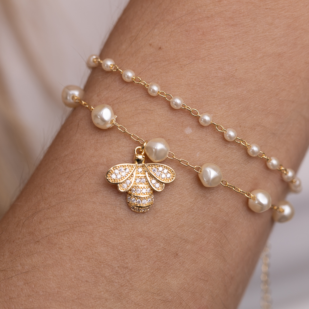 PULSEIRA PÉROLA COM LIBÉLULA CRAVEJADA BANHO OURO 18K