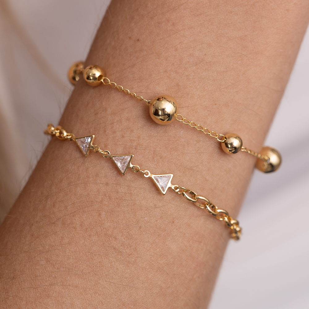 PULSEIRA ELOS OVAIS E TRIÂNGULOS CRISTAIS BANHO OURO 18K