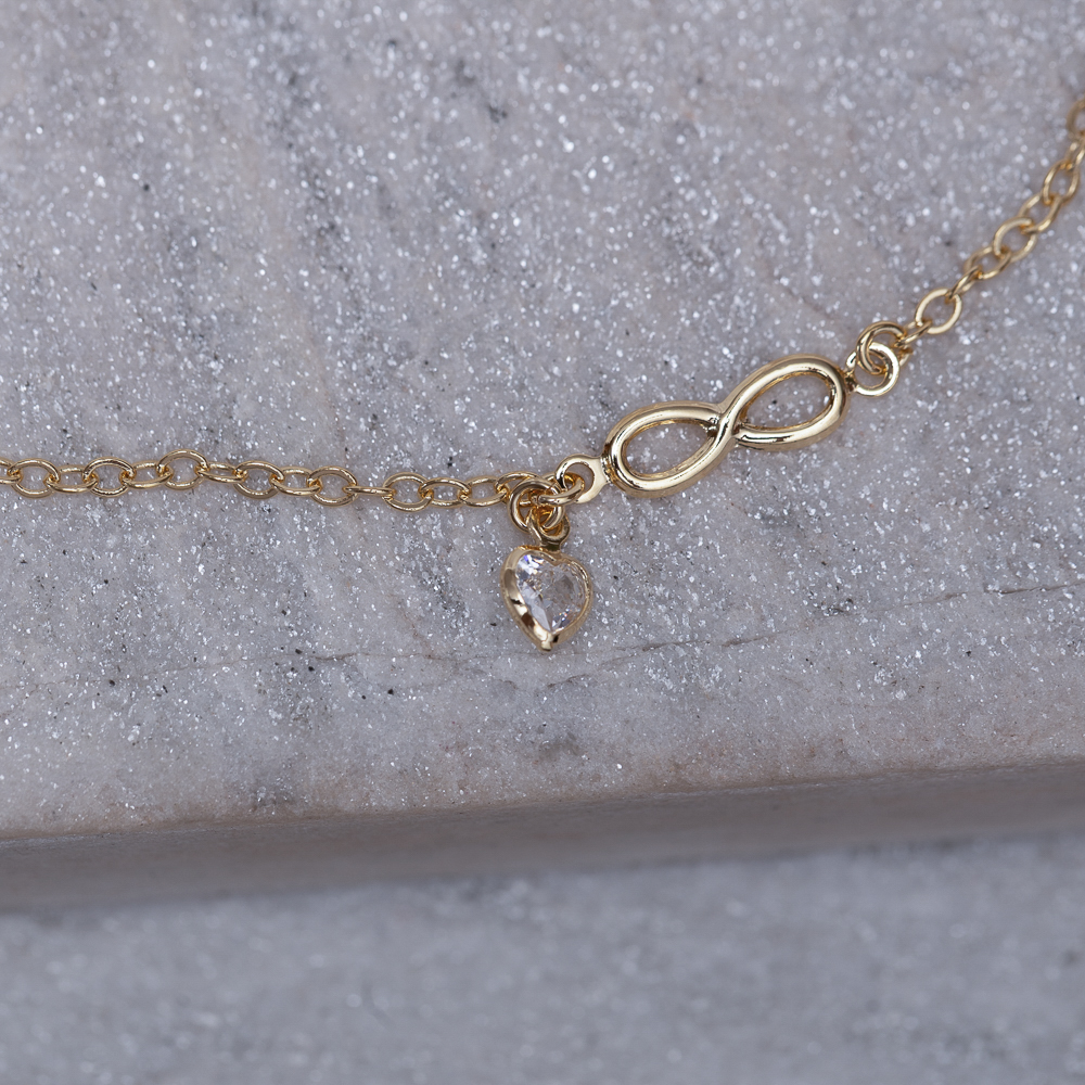 TORNOZELEIRA INFINITO COM PONTO DE LUZ BANHO OURO 18K