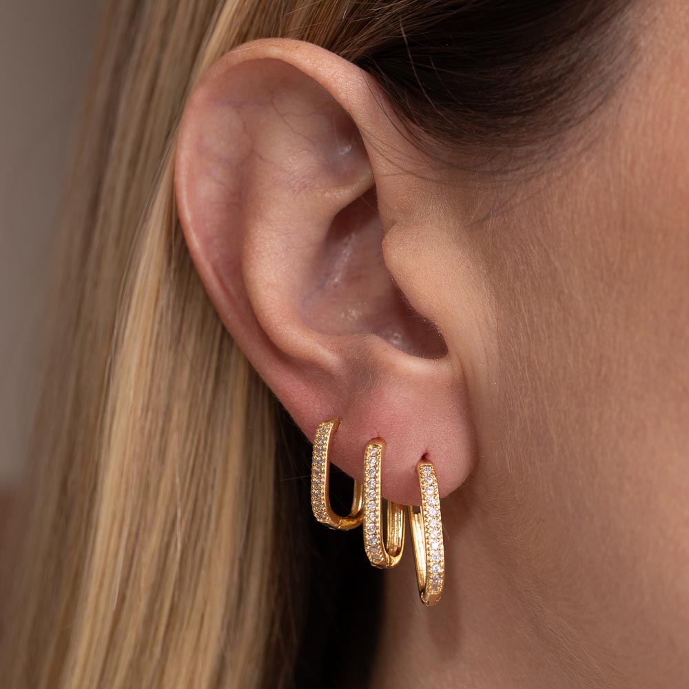 BRINCO ARGOLA OVAL CRAVEJADA P BANHO OURO 18K