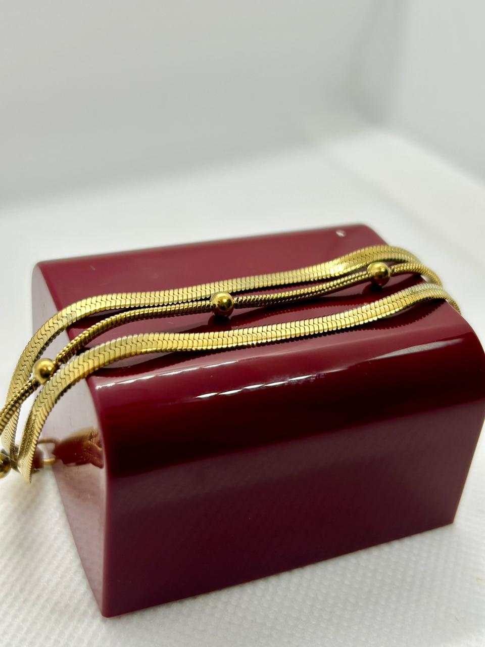 Pulseira três volta de aço dourado