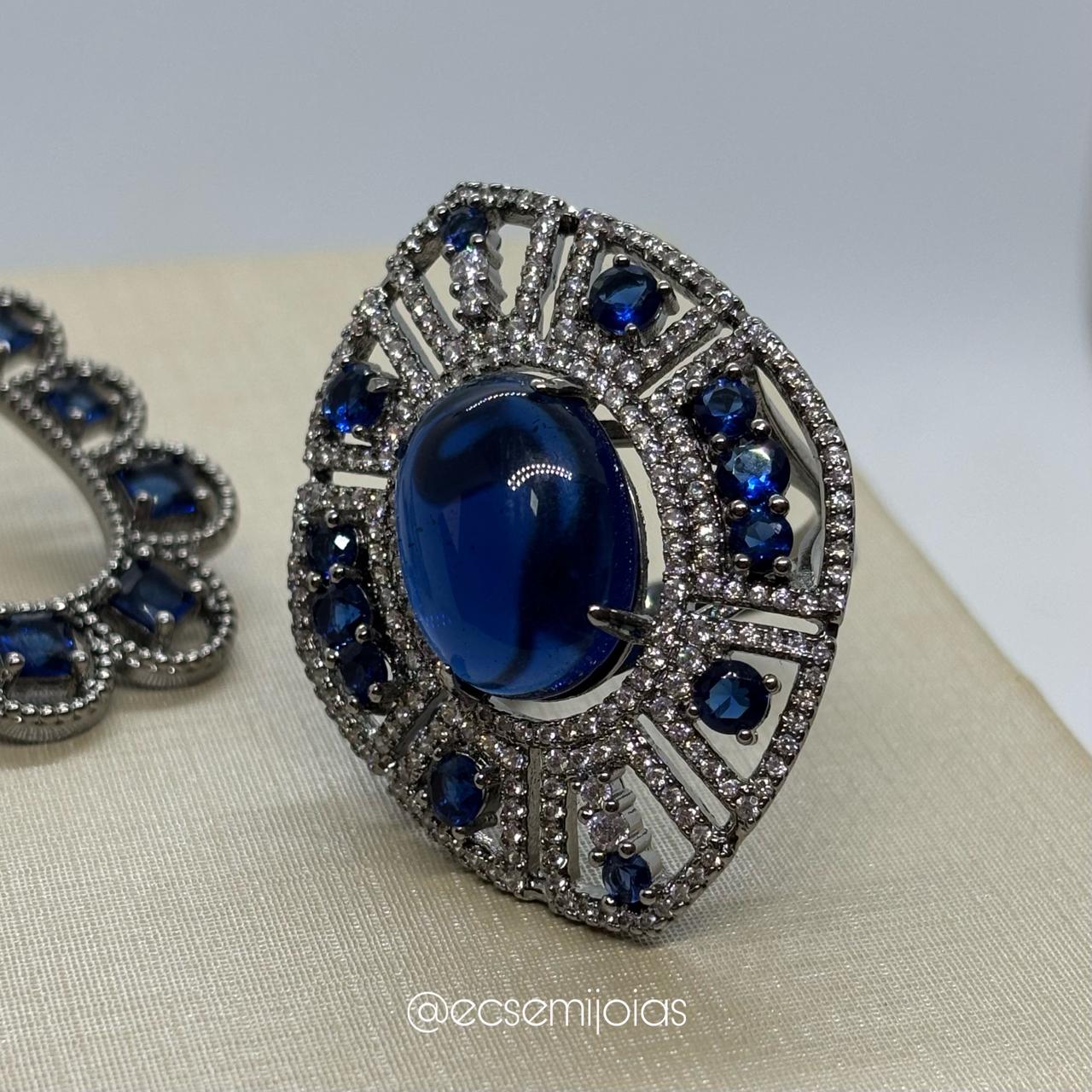 Conjunto de anel e brinco com pedra oval maior cravejado em volta - banhado a ródio negro